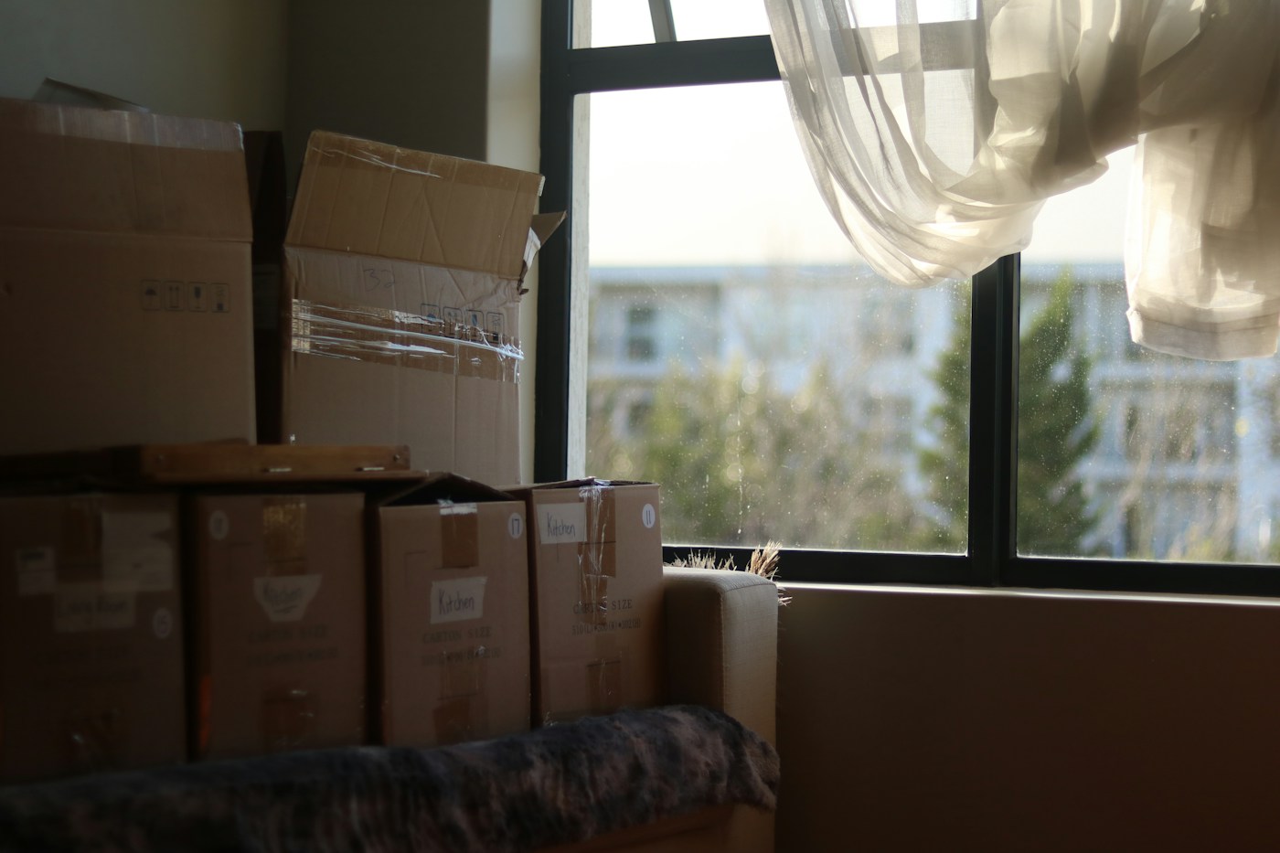 Cardboard boxes packed for moving home